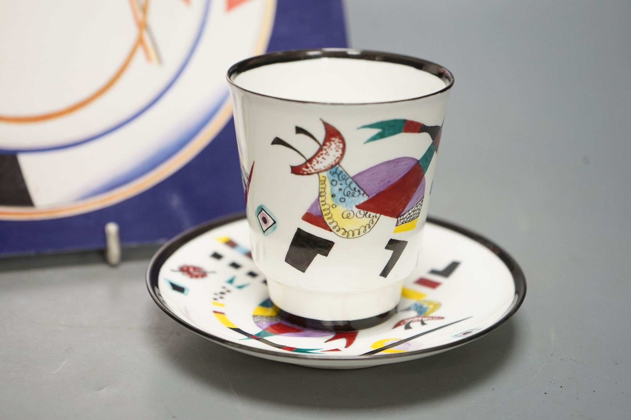 Russian Suprematist-style coffee cup and saucer, 20th century, together with a volume of Revolutionary Ceramics by Nina Lobanov-Rostovsky